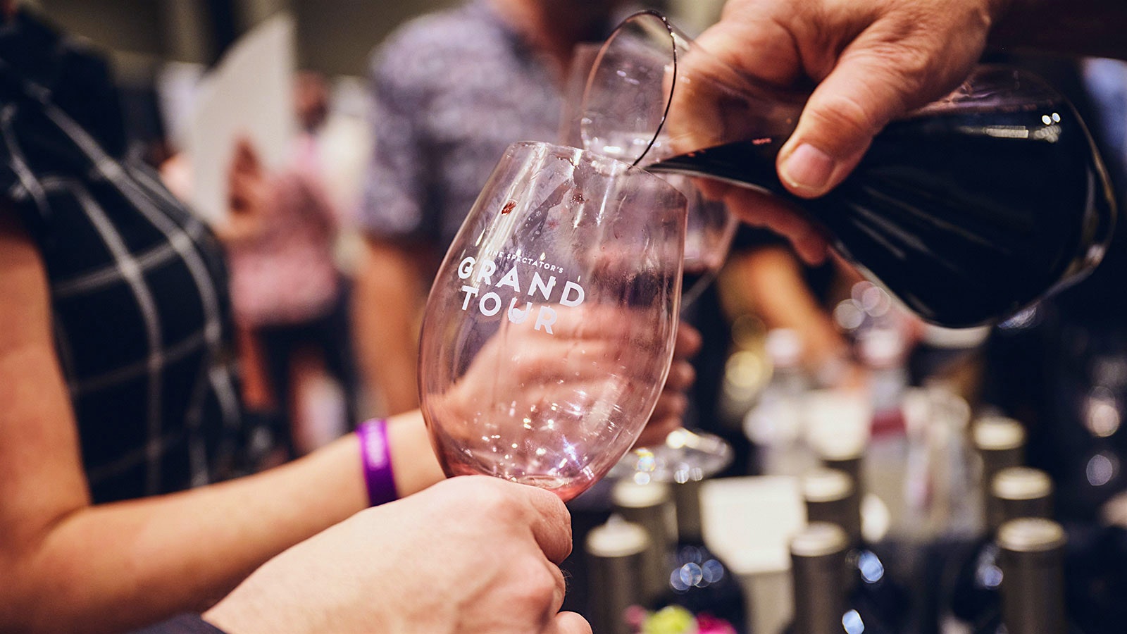  A winemaker pours a red wine at the Wine Spectator Grand Tour in New Orleans.